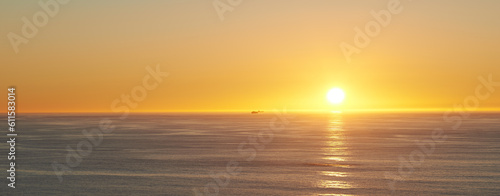 Orange sky  sunset and sea at morning on the horizon with ocean and waves landscape. Sunrise background  calm weather and summer by beach with coastline and outdoor environment with sun and mockup