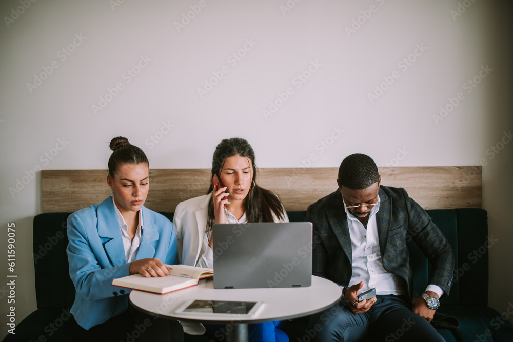 Three business colleagues sitting at the cafe Three business colleagues sitting at the cafe