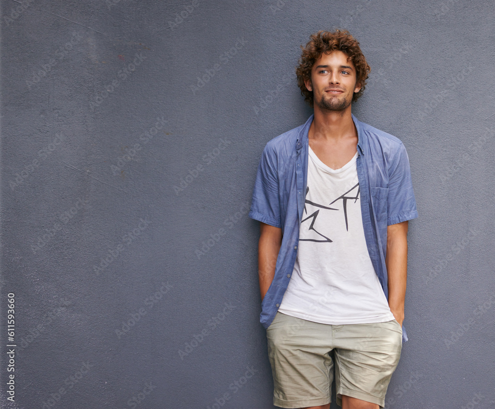 Confidence, casual and male model by a wall with mockup space with a hipster, cool and stylish outfit. Happy, positive and handsome man with trendy style or fashion by a gray background with mock up. Confidence, casual and male model by a wall with mockup space with a hipster, cool and stylish outfit. Happy, positive and handsome man with trendy style or fashion by a gray background with mock up.