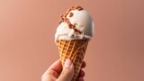 Hand holding waffle cone with delicious ice cream on studio background. Generative AI