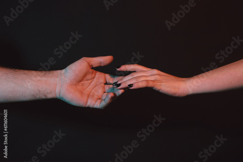 Reaching touching hands. Reach hand. Hopeful concept. Two hands trying to touch. Adam sign. Human relation, togetherness. Hands of man and woman reaching to each other. Hand try to touch.