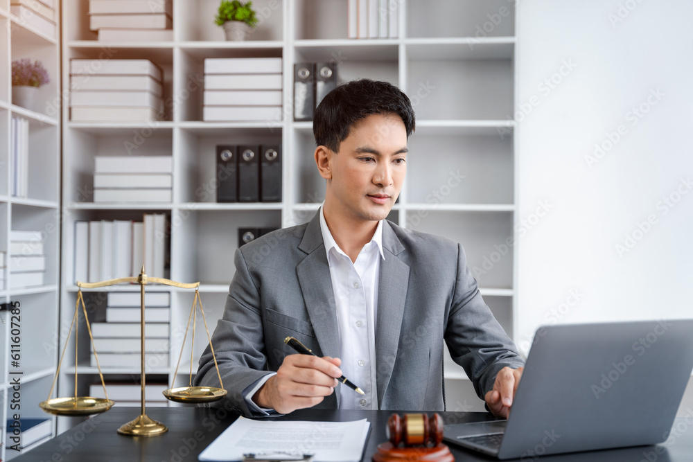 Lawyer office. gavel of Justice with scales and lawyer working on a laptop. Legal law, advice and justice concept. Lawyer office. gavel of Justice with scales and lawyer working on a laptop. Legal law, advice and justice concept.