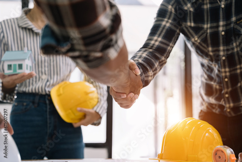 engineers shake hands while working for teamwork and cooperation after completing an agreement in an office facility, successful cooperation concept.