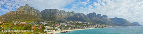 Mountain, travel and city by ocean in South Africa for tourism, traveling and global destination. Landscape, background and scenic view of beach by urban town for coastline, vacation and holiday © Dhoxax/peopleimages.com