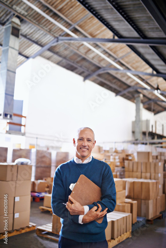 Delivery, smile and portrait of man in warehouse for cargo, storage and shipping. Distribution, ecommerce and logistics with employee in factory plant for supply chain, package or wholesale supplier © Y.A./peopleimages.com