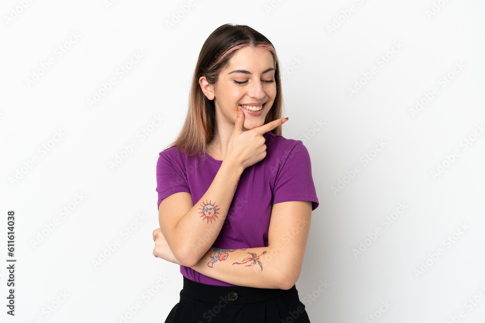Young caucasian woman isolated on white background looking to the side and smiling Young caucasian woman isolated on white background looking to the side and smiling