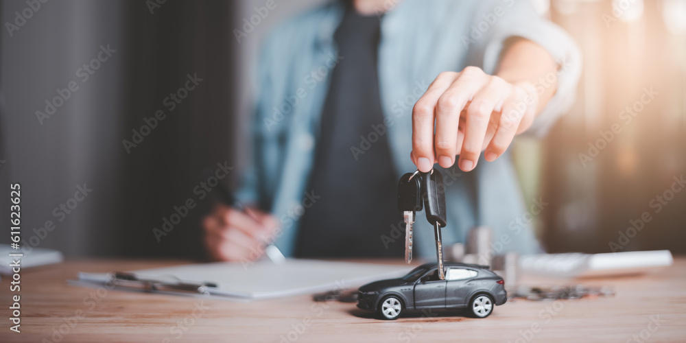 Car dealer and keys in hand ,Calculation of interest rates and car loan costs ,car purchase agreement ,Providing financial services and car insurance ,financial car loans ,Lease signing Car dealer and keys in hand ,Calculation of interest rates and car loan costs ,car purchase agreement ,Providing financial services and car insurance ,financial car loans ,Lease signing