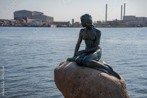The Little Mermaid Statue looking over the harbor in Copenhagen