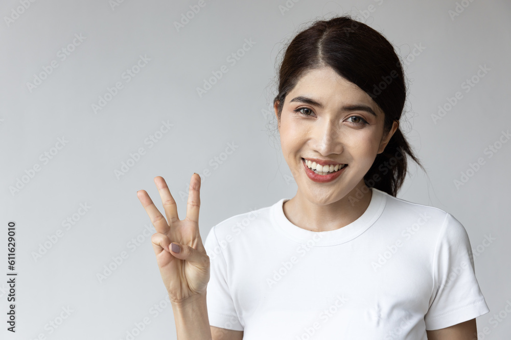 asian woman pointing up three fingers, 3 points gesture asian woman pointing up three fingers, 3 points gesture