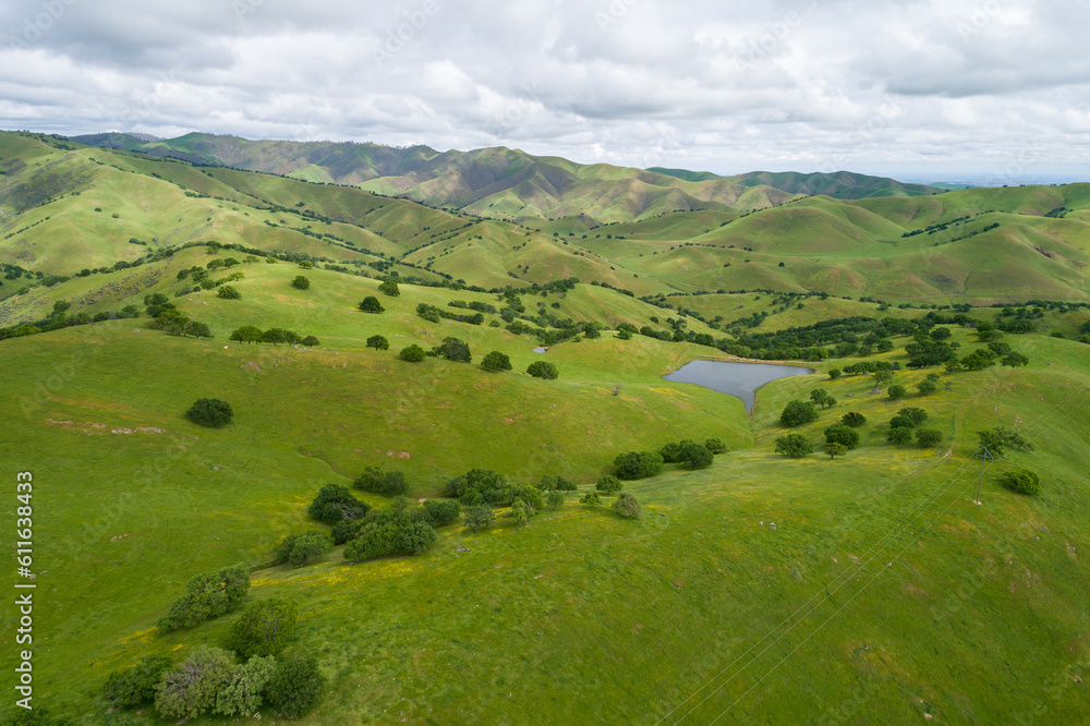 Upper Cottonwood Creek Wildlife Area. Beautiful Nature and Landscape. Green area with Cloudy Sky. Close to San Luis Reservoir. California, USA. Drone