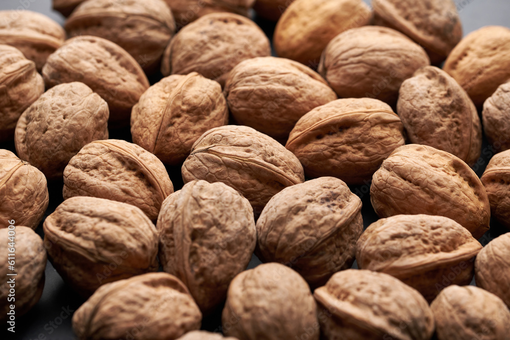 Whole walnuts nuts with shells close-up background studio shot Whole walnuts nuts with shells close-up background studio shot