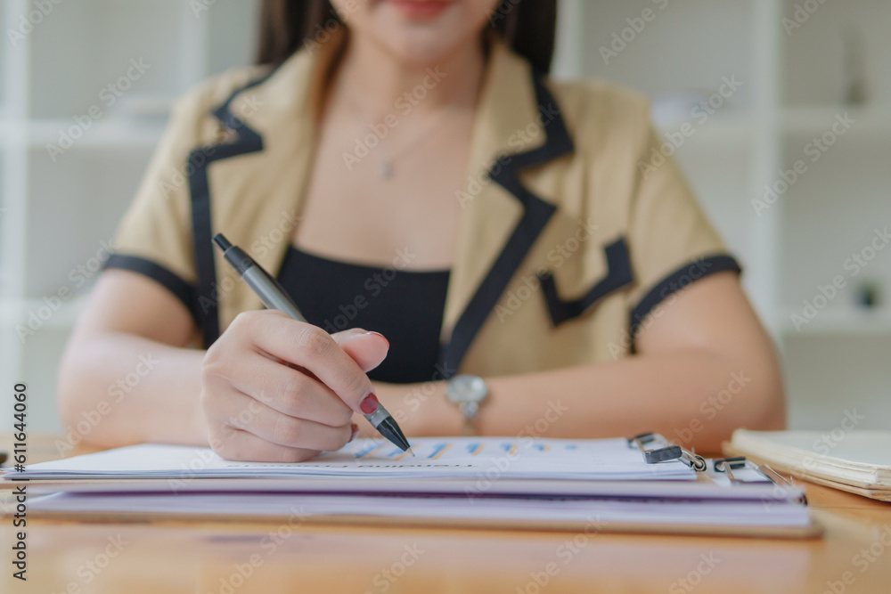 Hands holding pen and working with documents. Hands holding pen and working with documents.