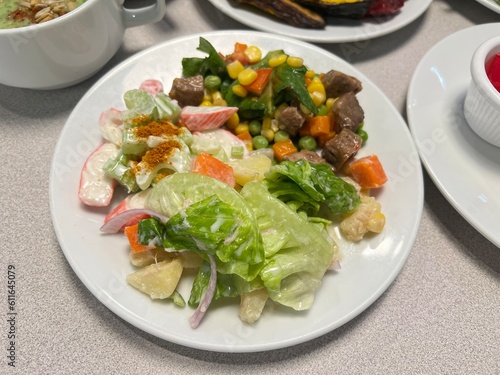 Mixed salad with fruits and pancake