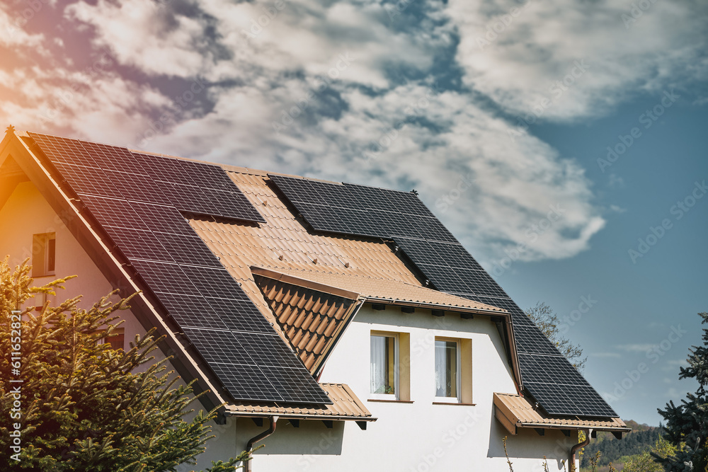 Fototapeta premium Concept of sustainable future. Solar roof installation company. Solar Panels and Photovoltaic.