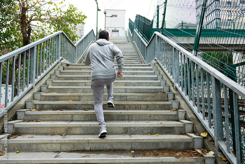 Young man running upstairs