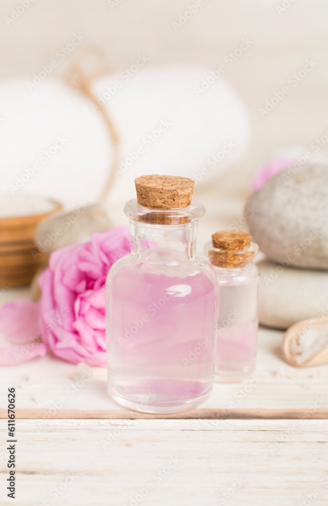 Spa composition with pink roses on wooden table Spa composition with pink roses on wooden table