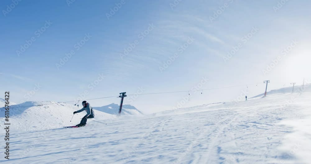 Experienced male skier skiing on slopes on a ski center. Recorded at 120 fps. Experienced male skier skiing on slopes on a ski center. Recorded at 120 fps.