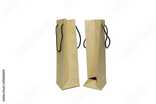 Brown paper shopping bag isolated on white background. Clipping path included.