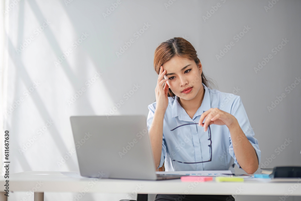 Puzzled confused asian woman thinking hard concerned about online problem solution looking at laptop screen, worried serious asian businesswoman focused on solving difficult work computer task Puzzled confused asian woman thinking hard concerned about online problem solution looking at laptop screen, worried serious asian businesswoman focused on solving difficult work computer task