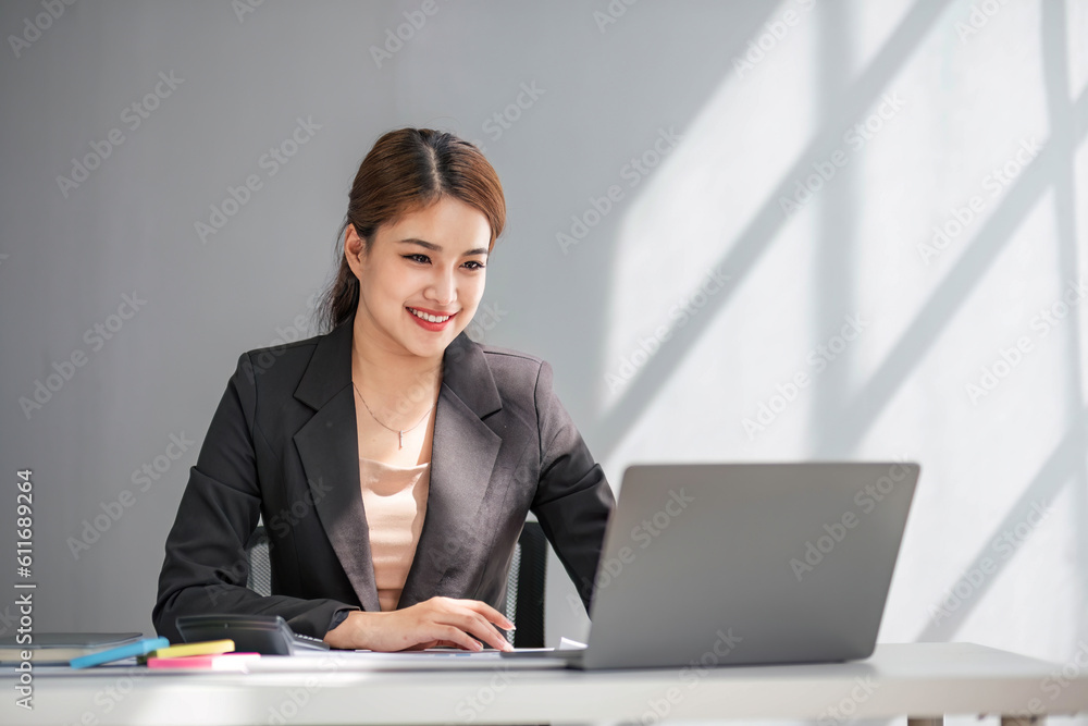 Business woman using calculator for do math finance on wooden desk in office and business working background, tax, accounting, statistics and analytic research concept. Business woman using calculator for do math finance on wooden desk in office and business working background, tax, accounting, statistics and analytic research concept.