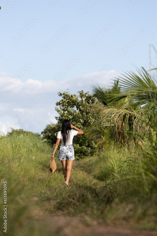 girl with a hat in the country side