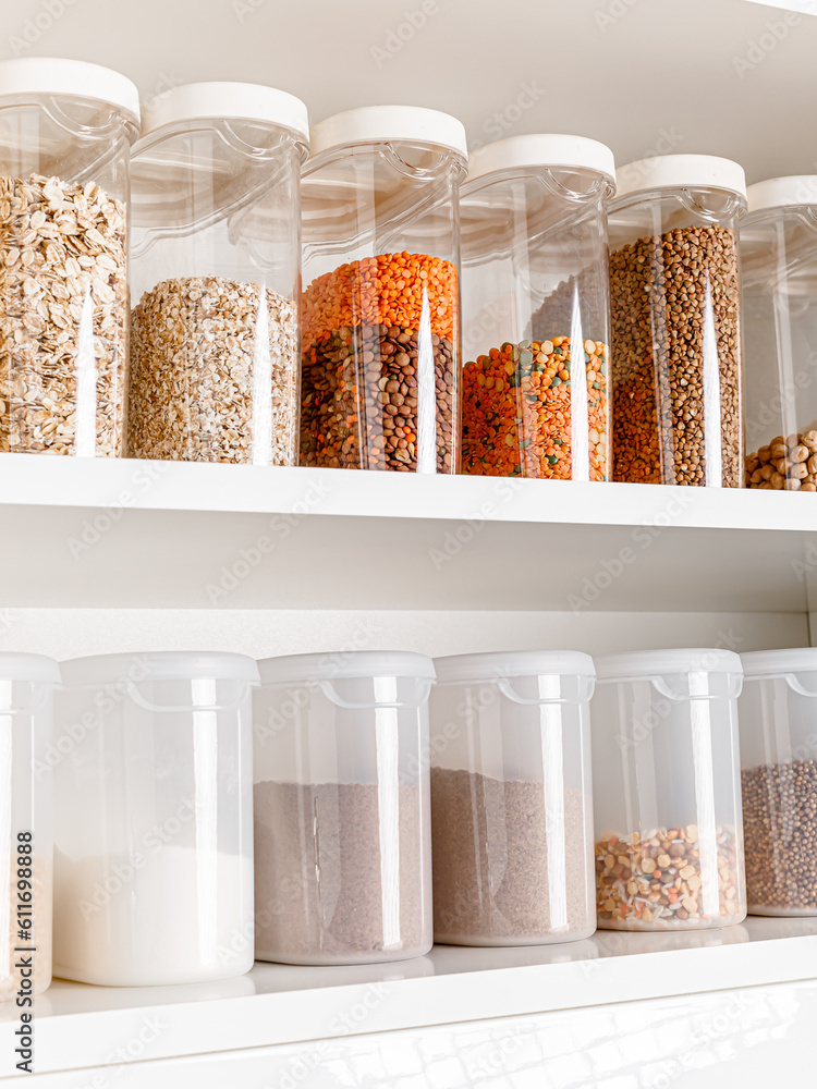 Stocked kitchen pantry with food. The organization and storage in a