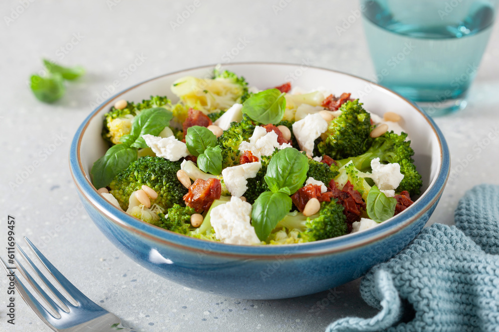 healthy broccoli salad with feta cheese sun dried tomatoes pine nuts. vegetarian low carb keto diet healthy broccoli salad with feta cheese sun dried tomatoes pine nuts. vegetarian low carb keto diet