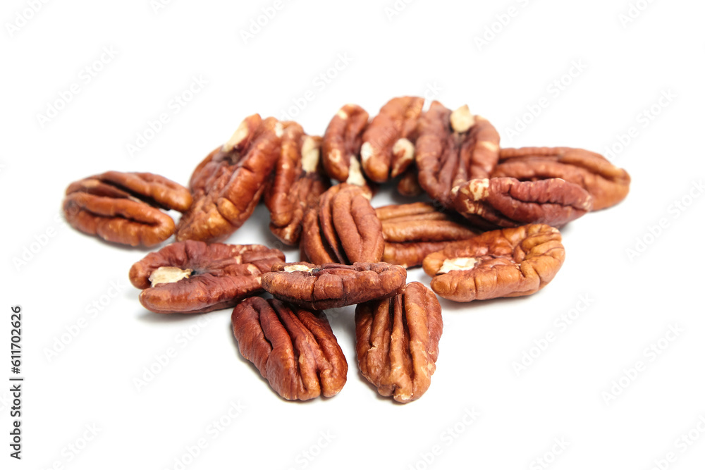 Heap of pecan nut halves isolated on a white . Peeled pecan nuts closeup Heap of pecan nut halves isolated on a white . Peeled pecan nuts closeup