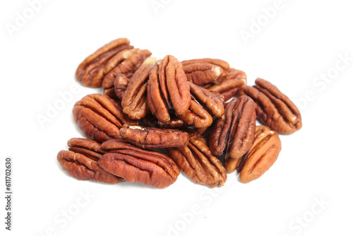 Heap of pecan nut halves isolated on a white . Peeled pecan nuts closeup