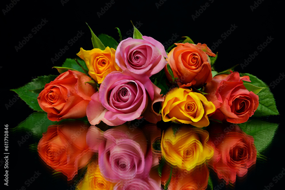 Beautiful Bouquet of roses and flowers, used for love and passion and wedding bells. Shot on a reflective surface in a studio with a dark black background.Beautiful Vintage, stacked on top Beautiful Bouquet of roses and flowers, used for love and passion and wedding bells. Shot on a reflective surface in a studio with a dark black background.Beautiful Vintage, stacked on top