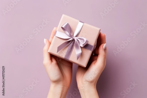 hands holding small gift with ribbon, AI generative © dark_blade