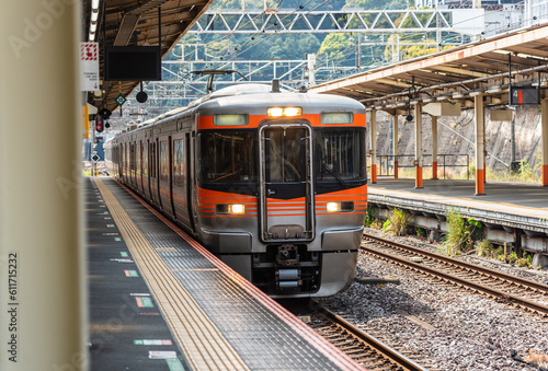Valokuva Local train arrive to railway station platform in Japan.