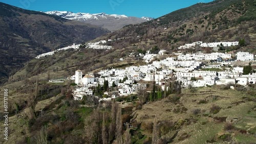 Aerial view above the beautiful villages of Capileira and Bubión in the gorge of the Poqueira in Andalusia Spain	 photo