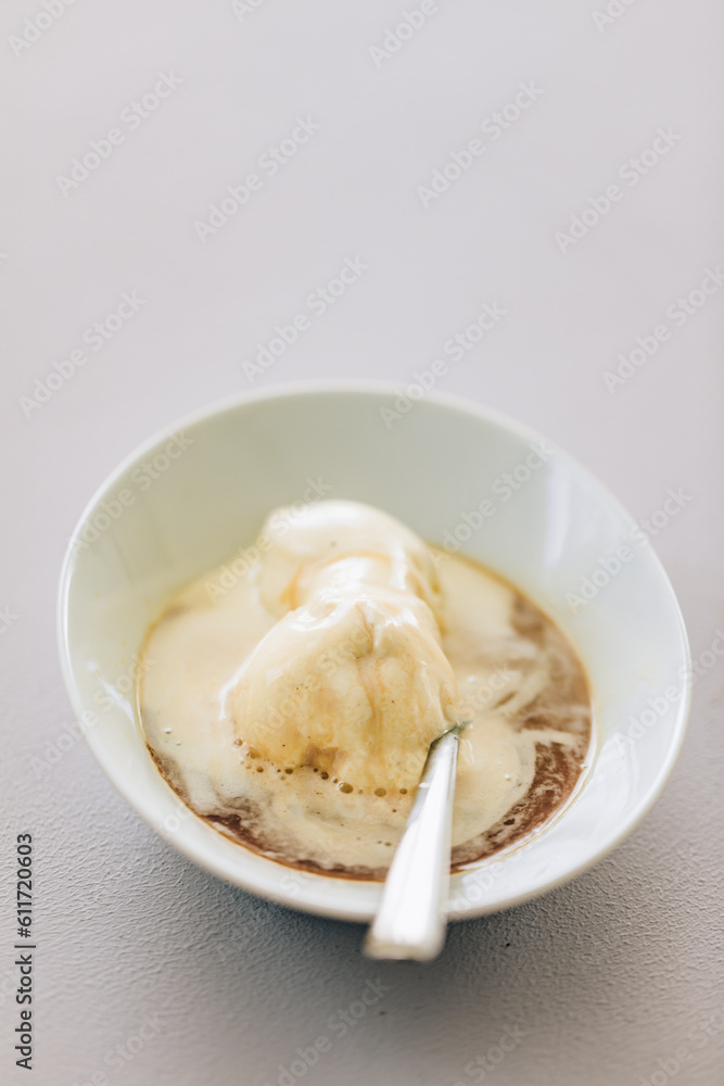 Vanilla ice cream with espresso called affogato Vanilla ice cream with espresso called affogato