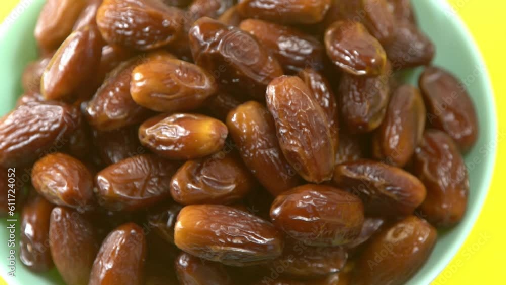 Dates. Dried date palm fruits. Healthy sweet snack food bowl. Pile of tasty dry dattes in plate. Date harvest symbolizing Ramadan. Dates. Dried date palm fruits. Healthy sweet snack food bowl. Pile of tasty dry dattes in plate. Date harvest symbolizing Ramadan.