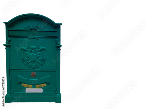 Green mail box on the wall of an old house in Italy.