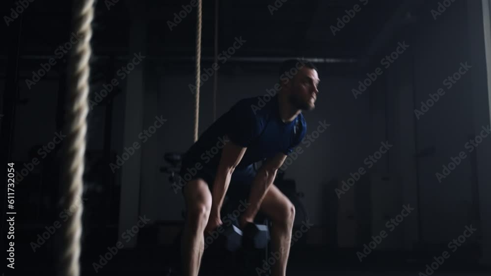 Man Training Alone In Gym, Doing Push-Ups And Lifting Dumbbells, Powerlifting And Bodybuilding Man Training Alone In Gym, Doing Push-Ups And Lifting Dumbbells, Powerlifting And Bodybuilding