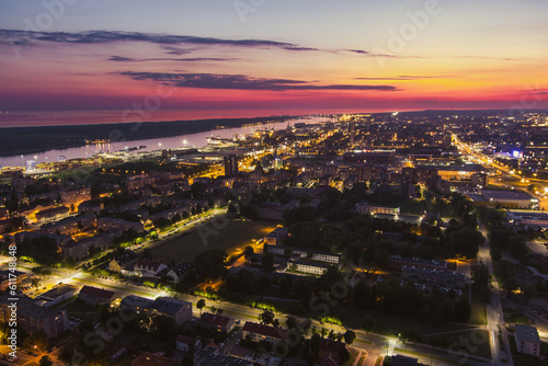 Scenic aerial view of the Old town of Klaipeda  Lithuania in purple evening light. Klaipeda city port area and it s surroundings.