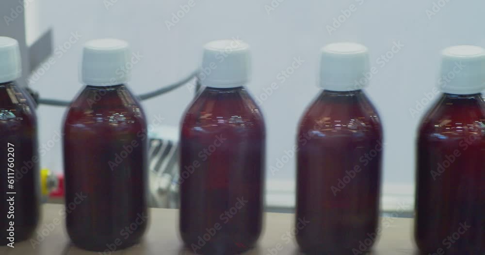 closed plastic bottles move along the conveyor.close-up. closed plastic bottles move along the conveyor.close-up.