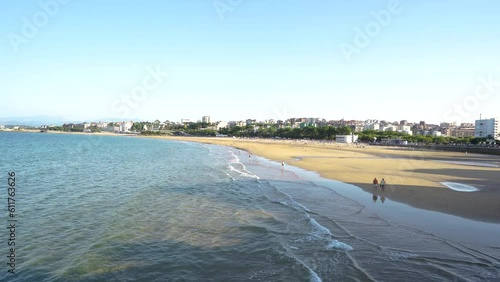 Beautiful El Sardinero beach, Santander , Spain. Stabilized static footage. People at the beach enjoying a sunny afternoon. Travel destinatuon in North of Spain. View of Santander city, in background photo