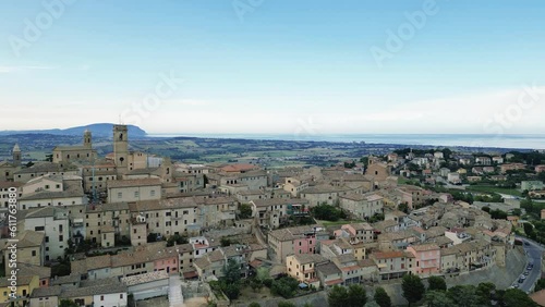 italy, june 2023 - aerial view of the medieval village of Potenza Picena in the province of Macerata in the Marche region. From the town you can see Mount Conero and the Adriatic Sea in the background photo