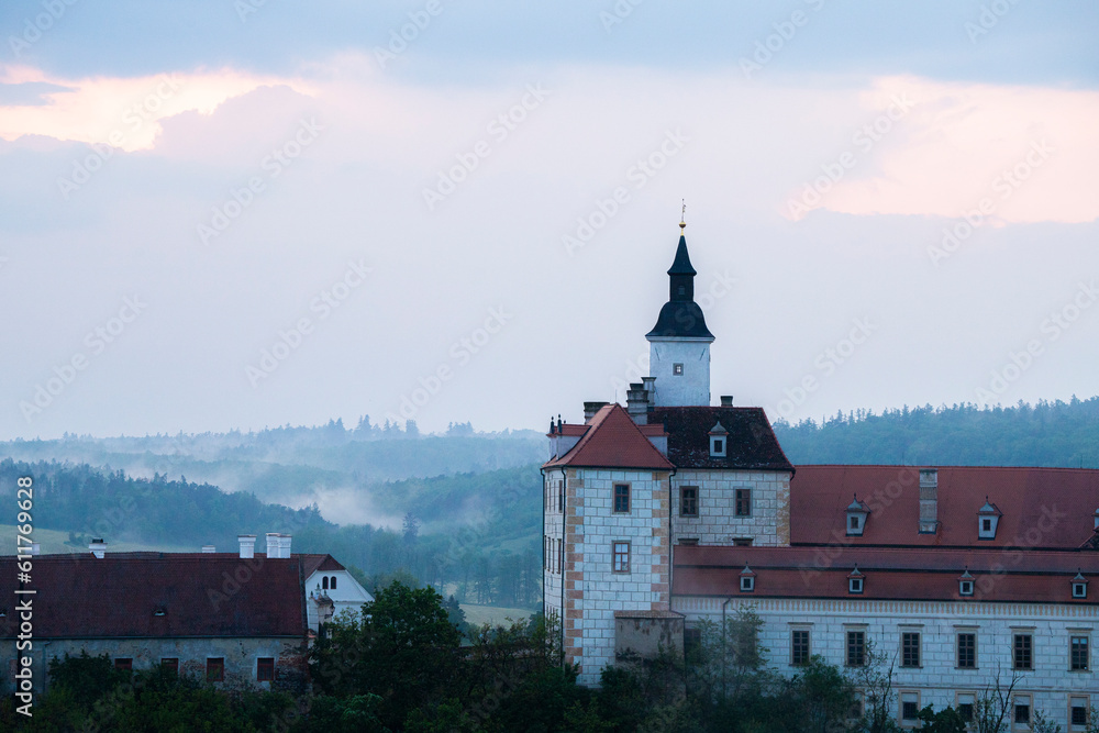 Jevišovice castle viewed from the forest. European castle in countryside landscape