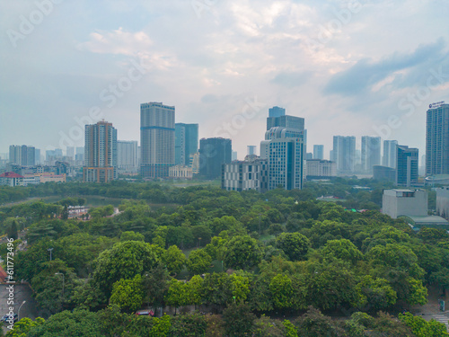 Aerial view of Hanoi Downtown Skyline with green garden park, Vietnam. Financial district and business centers in smart urban city in Asia. Skyscraper and high-rise buildings.