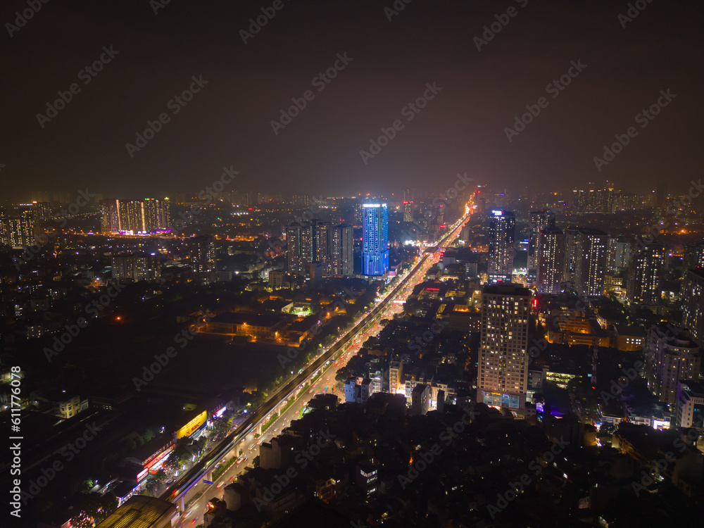 Fototapeta premium Aerial view of Hanoi Downtown Skyline, Vietnam. Financial district and business centers in smart urban city in Asia. Skyscraper and high-rise buildings at night.