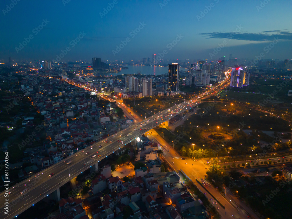 Aerial view of Hanoi Downtown Skyline, Vietnam. Financial district and business centers in smart urban city in Asia. Skyscraper and high-rise buildings at night.