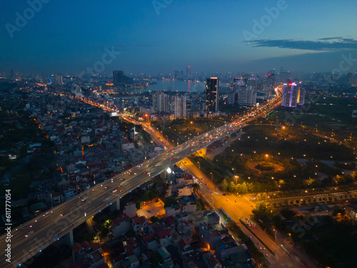 Aerial view of Hanoi Downtown Skyline, Vietnam. Financial district and business centers in smart urban city in Asia. Skyscraper and high-rise buildings at night. © tampatra