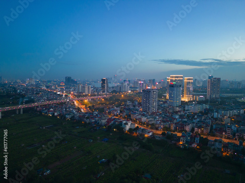 Aerial view of Hanoi Downtown Skyline  Vietnam. Financial district and business centers in smart urban city in Asia. Skyscraper and high-rise buildings at night.