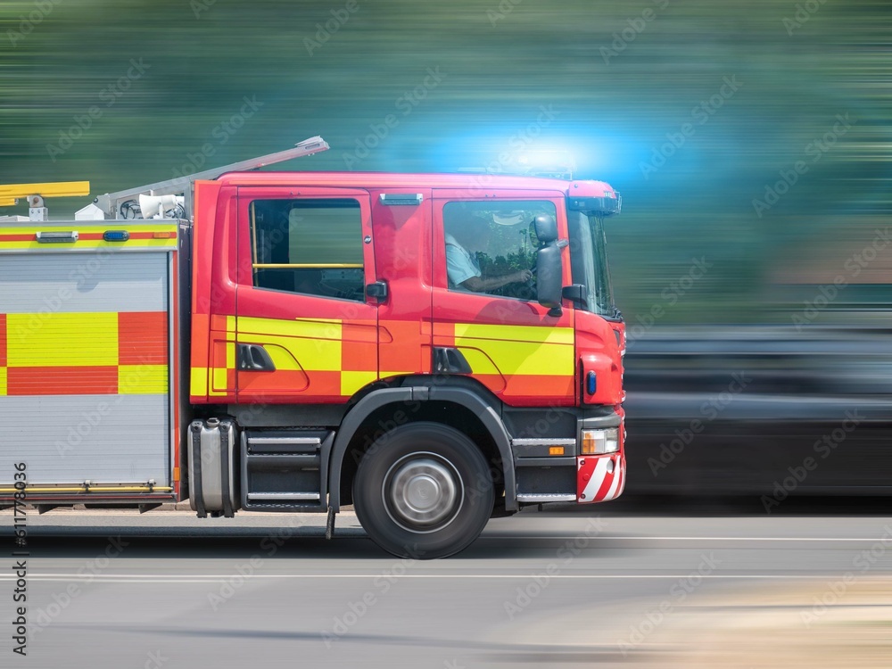 British Fire Engine Speeding Along Road In Response To Emergency 999 Call - England, Britain
