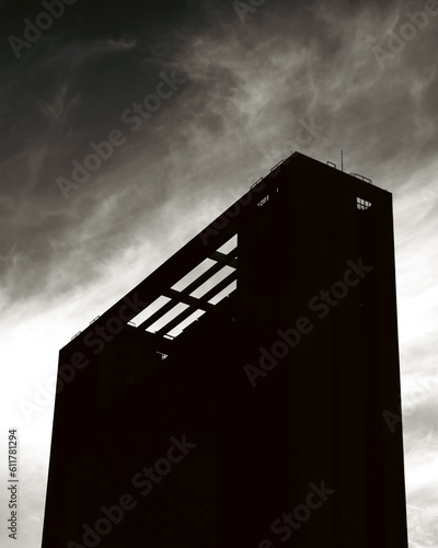 A silhouette of skyscrapers against a sunset backdrop