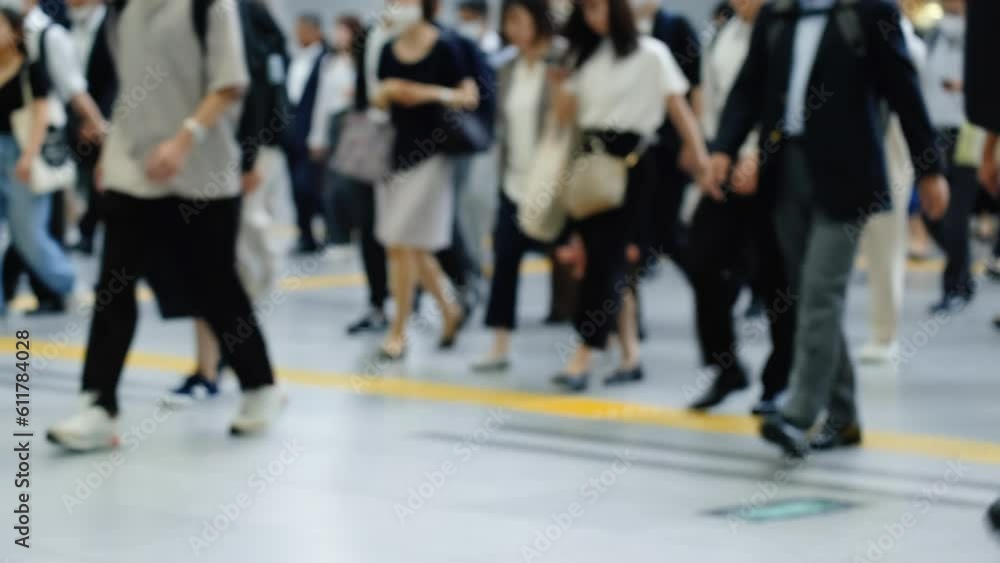 Many commuters going to work in the busy morning rush hour. Slow motion. Low angle. Many commuters going to work in the busy morning rush hour. Slow motion. Low angle.